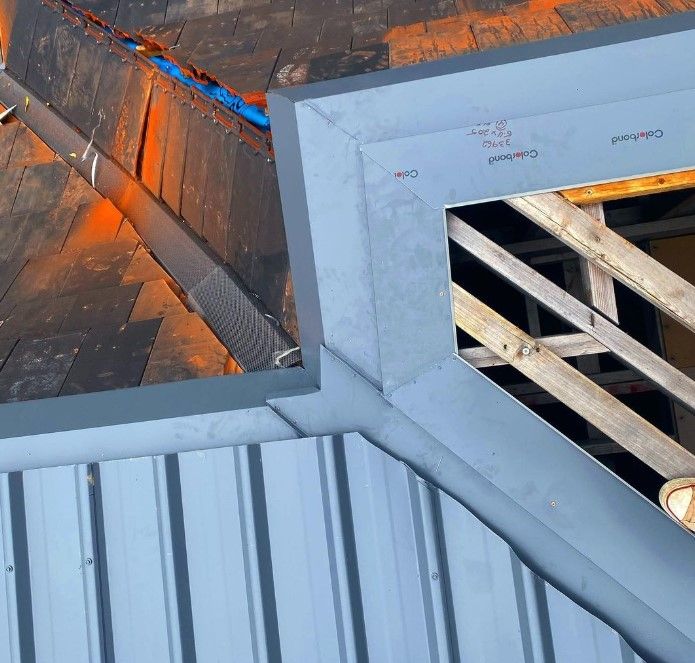 Roofer Builder Worker Finishing Folding a Metal Sheet | Riverside, Nsw | Avidity Metal Roofing Pty Ltd