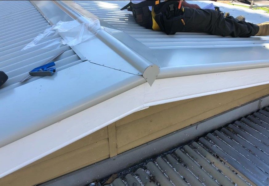 Worker Builder with Hand Drill at Metal Profile Roof Installation | Riverside, Nsw | Avidity Metal Roofing Pty Ltd