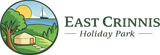 Logo for East Crinnis Holiday Park featuring a round illustration of a yurt, tree, and sailboat on water.