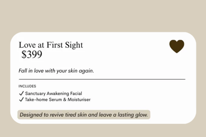 Woman in black bikini seated cross-legged in a sauna, with blue and amber lighting.