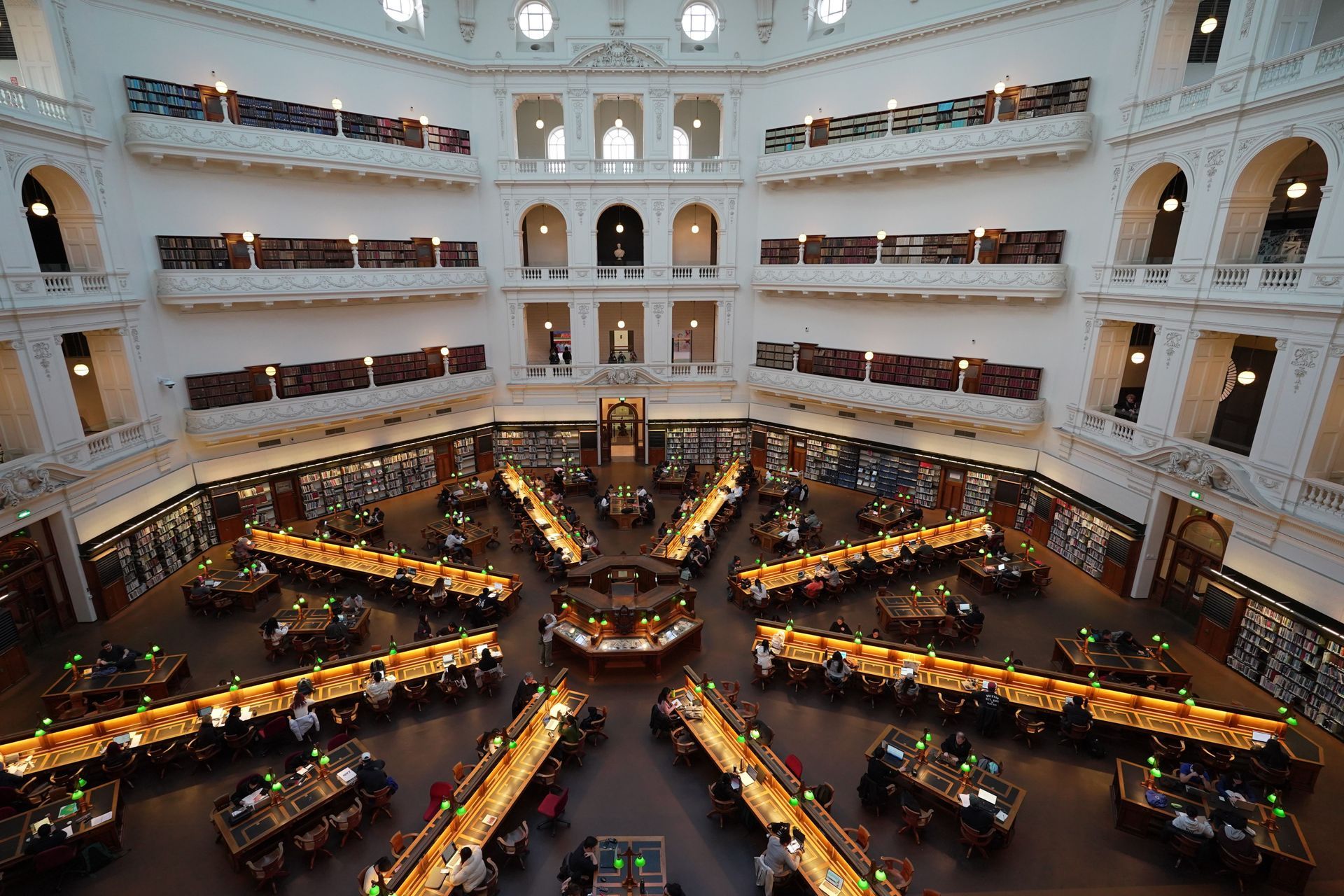 Students working in a large library