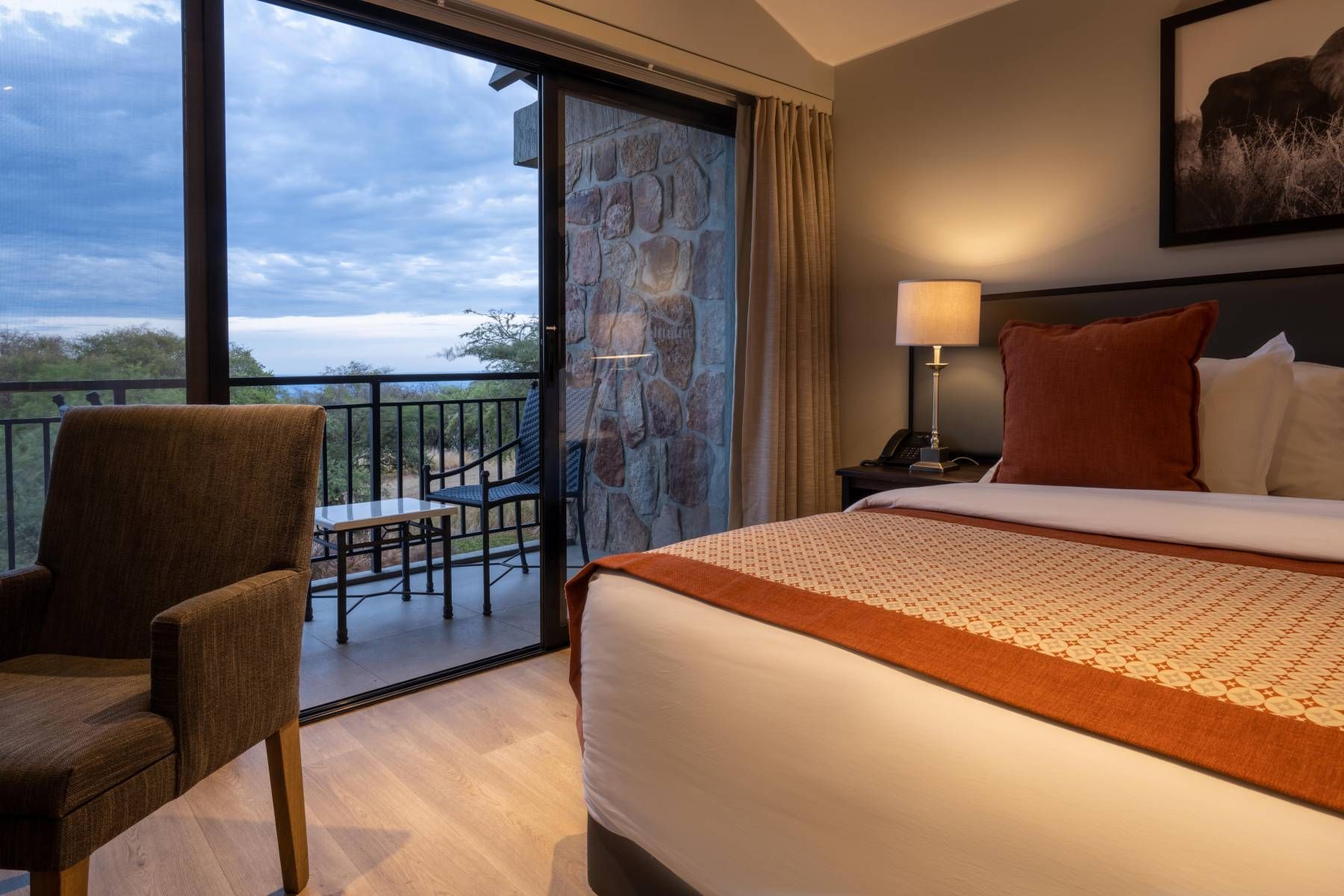 Interior Balcony room at Akagera Game Lodge with curtains open