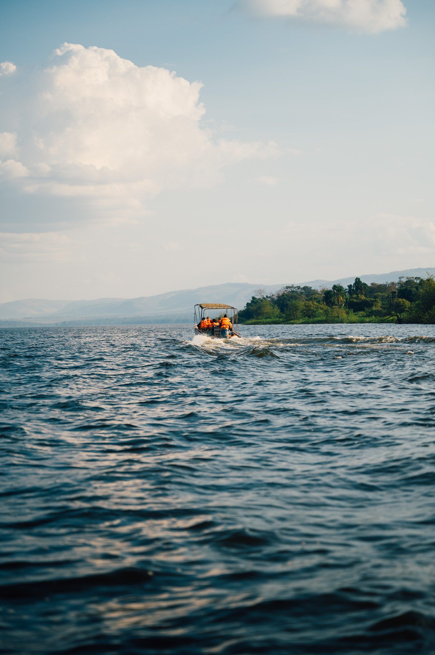 boat taking off on lake ihema during a sunset boat trip