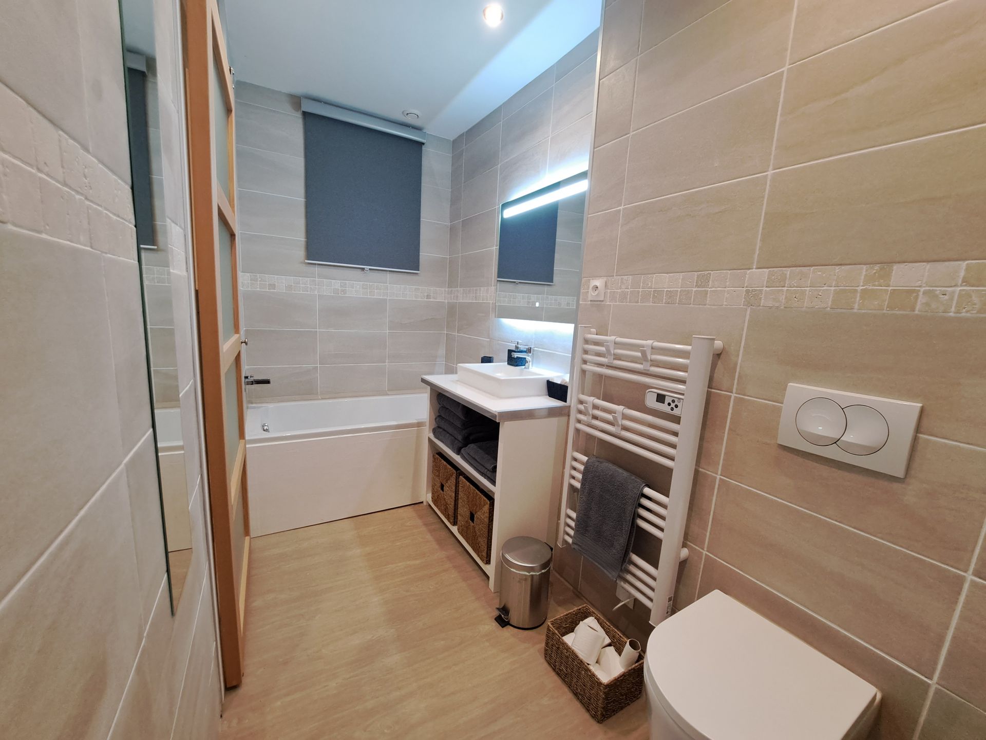 bathroom with bath, loo and sink