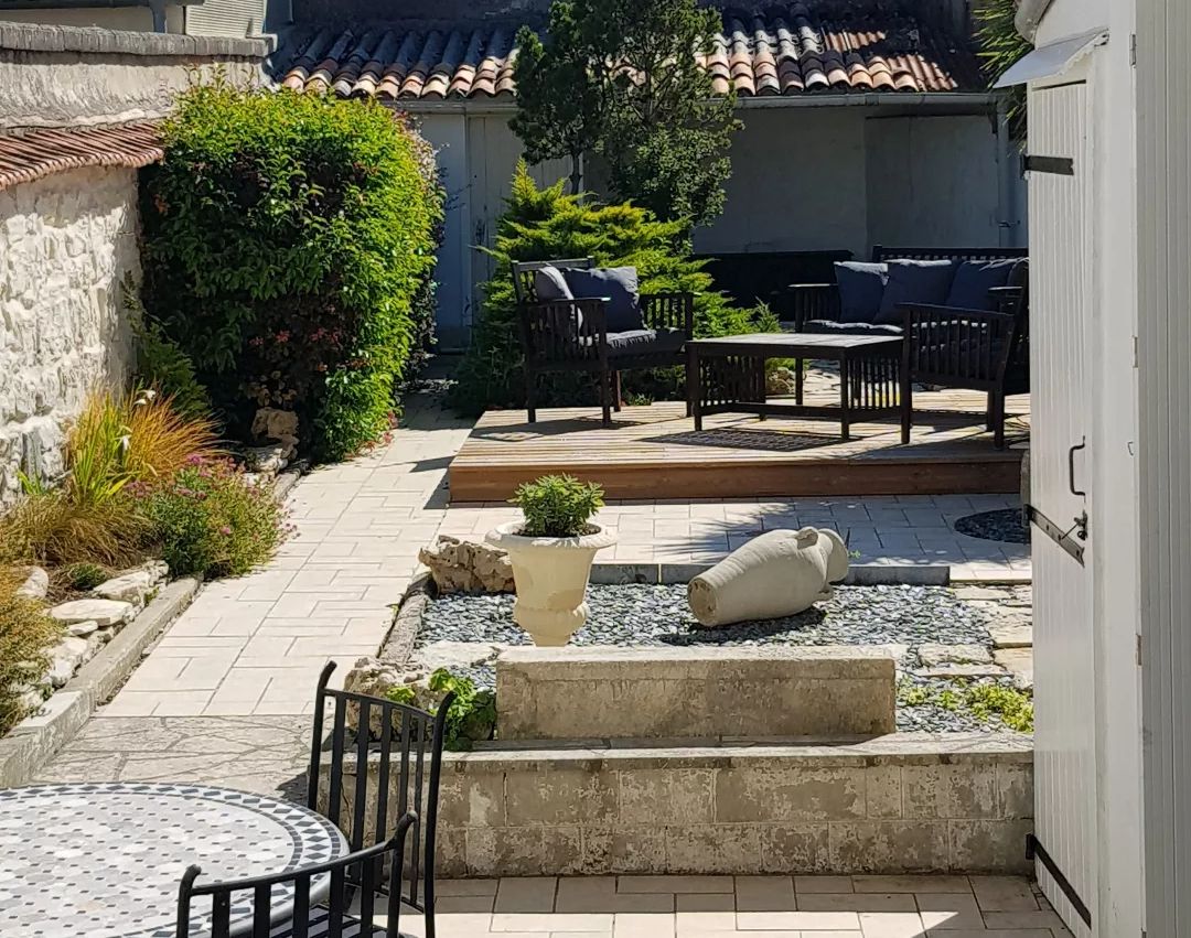 garden after renovation, decked area with garden furniture