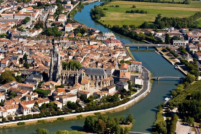 view of Saintes from the air showing the river