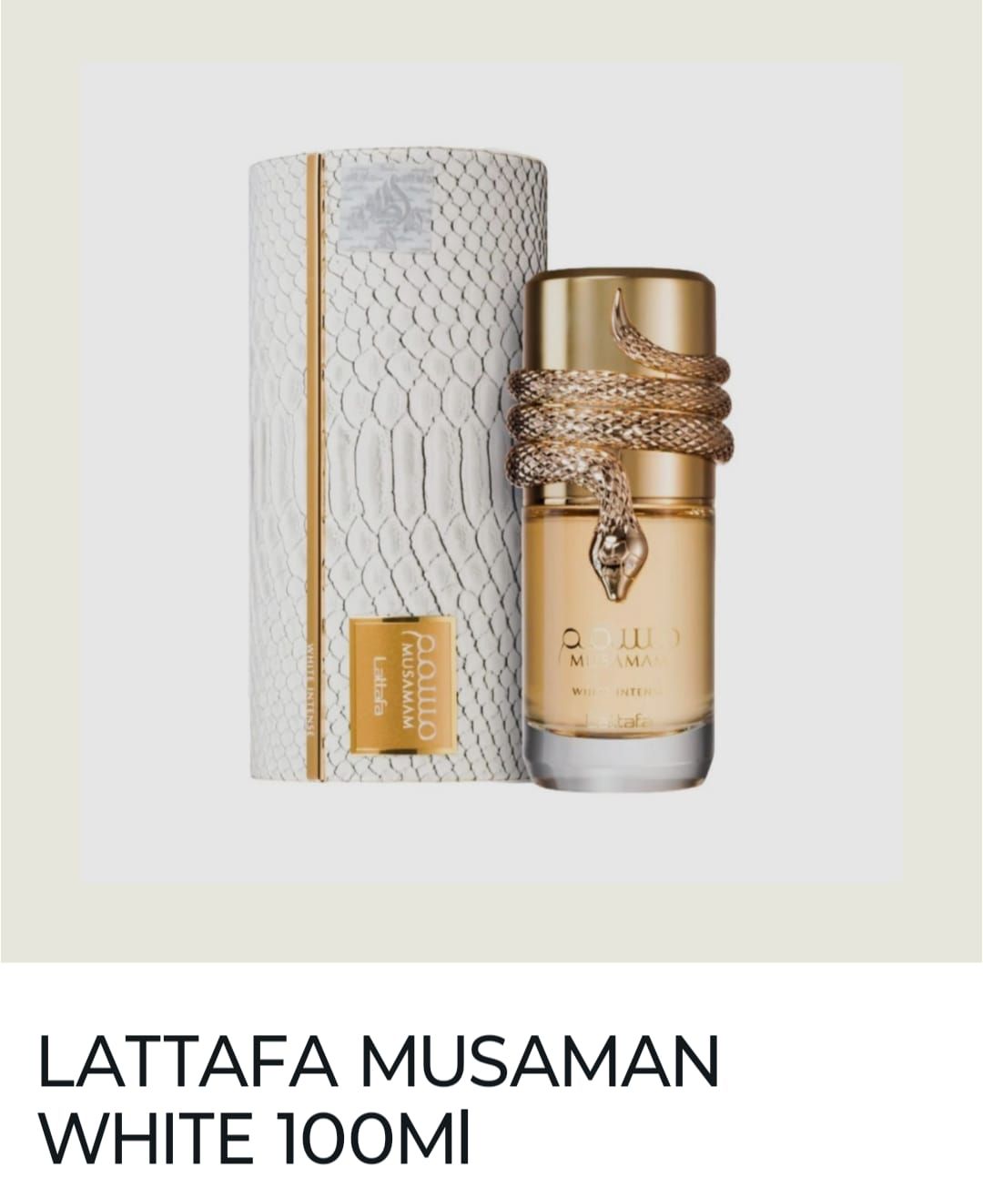 Frasco y caja de perfume Lattafa Musamam White Gold en envase dorado y blanco.