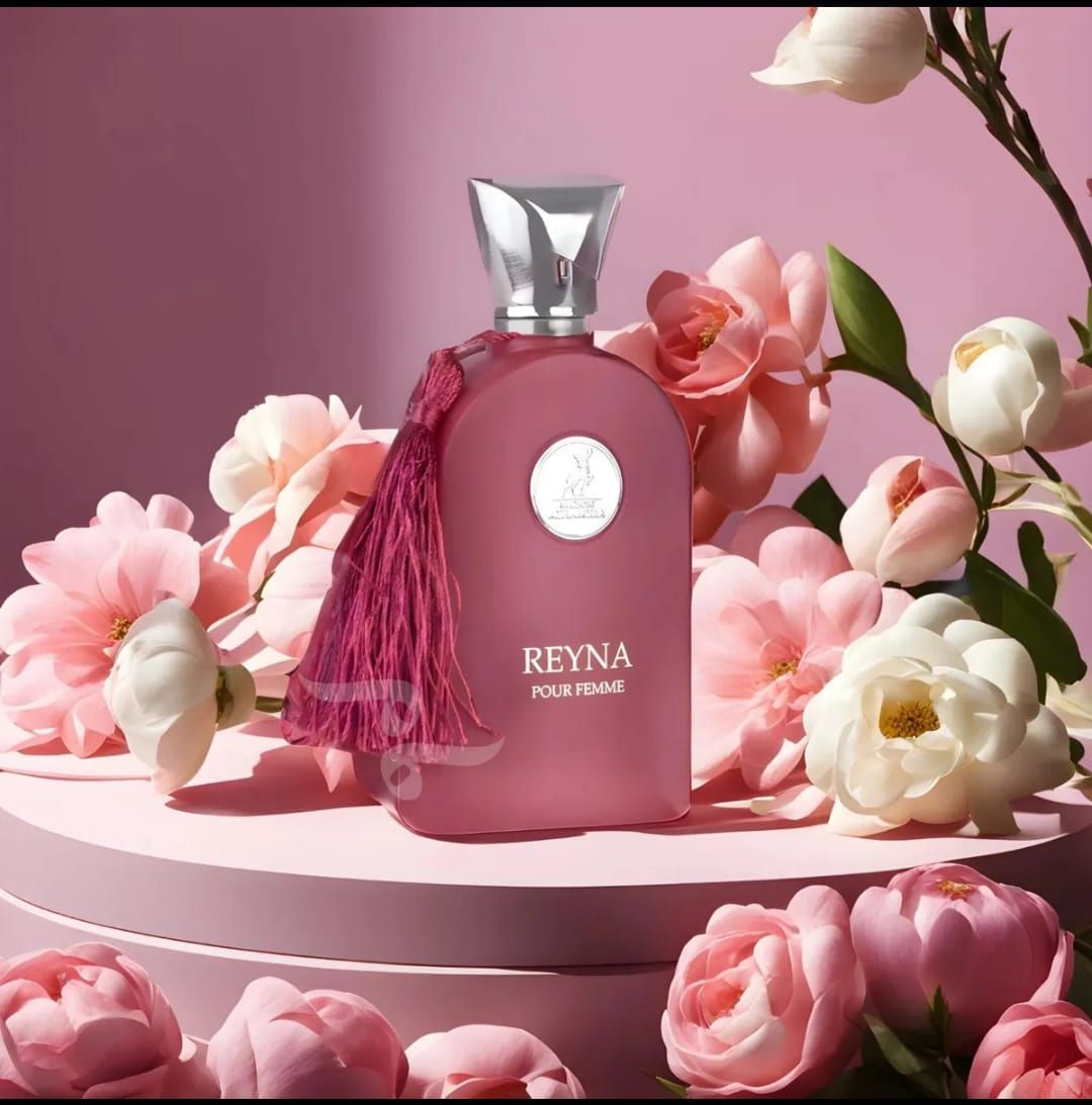 Caja y frasco de perfume Pink Reyna Pour Femme con tapón y borla plateados.