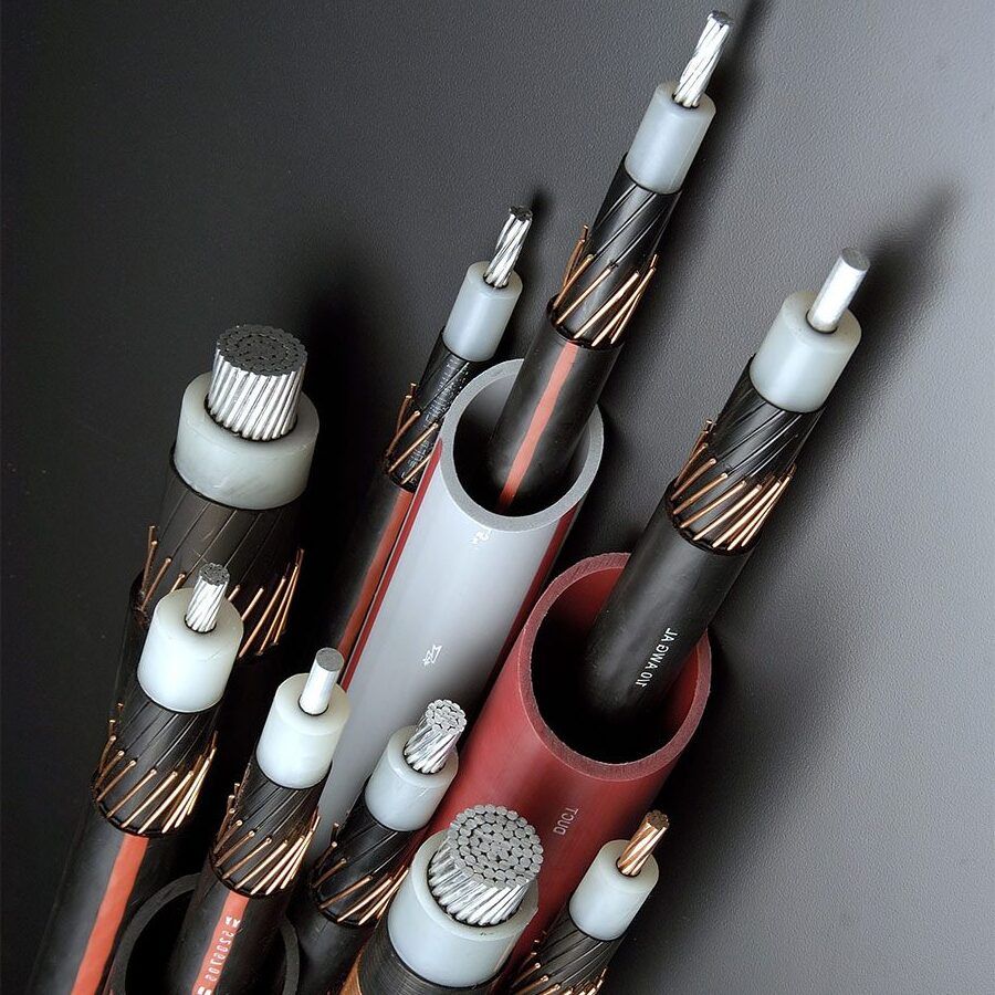 Cutaway view of several multi-core electrical cables with exposed copper conductors and insulated ends