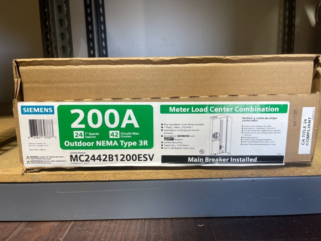 Box labeled “300A” Siemens meter load center combination sitting on a shelf in a storage area