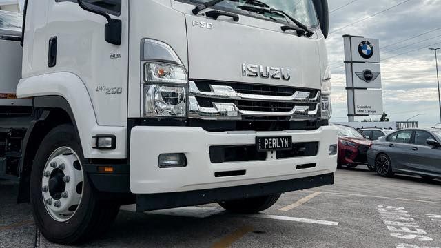 White Isuzu truck with 