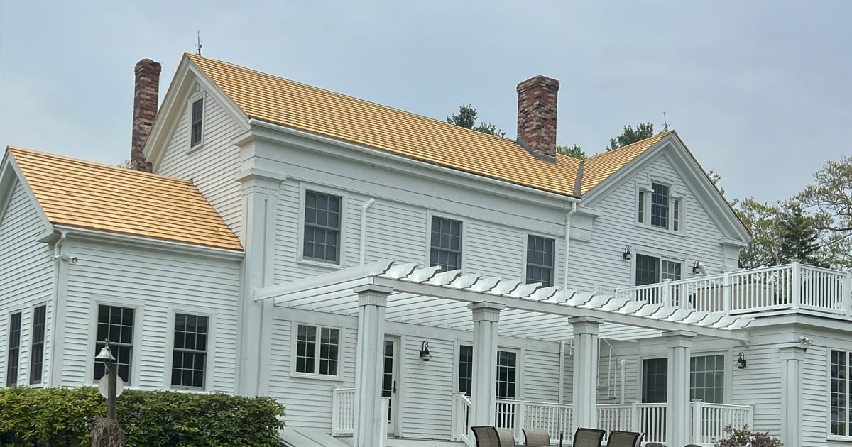 picture of white house with tan roof