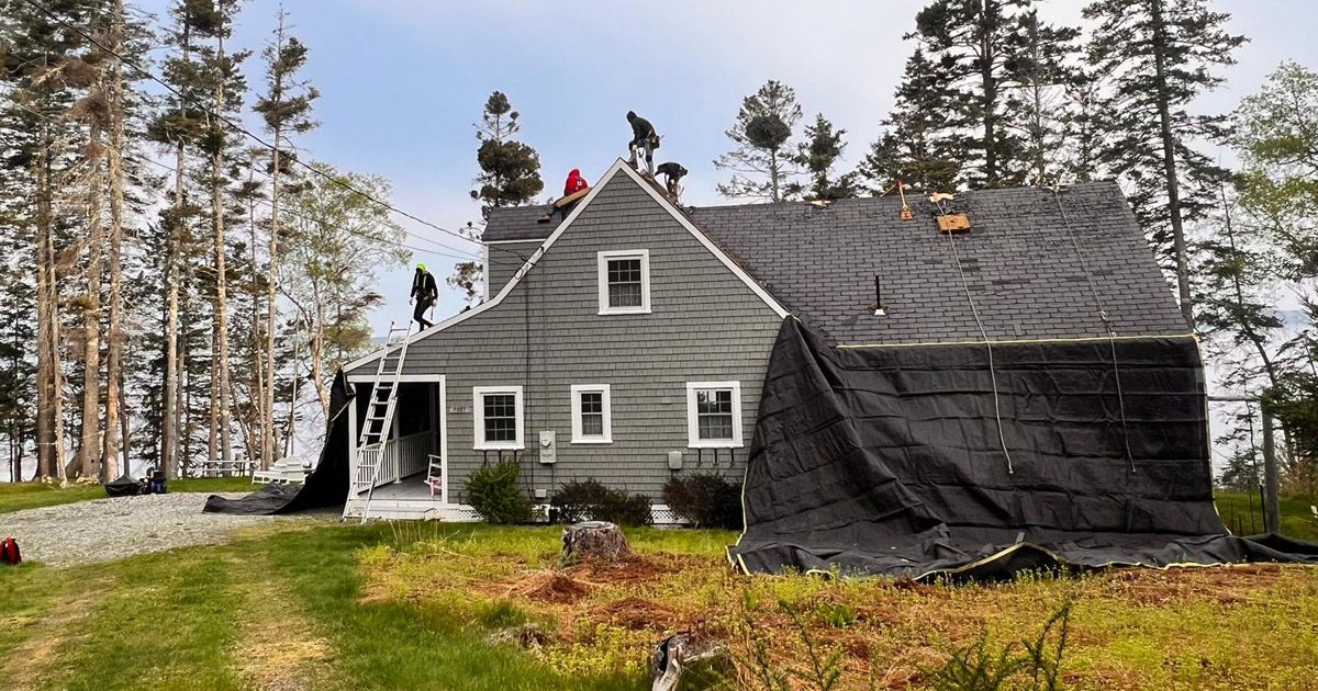 people doing roof tiling