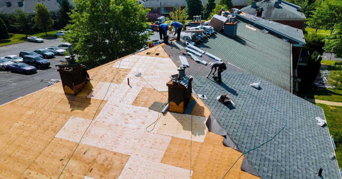 image of roofers working on a roof