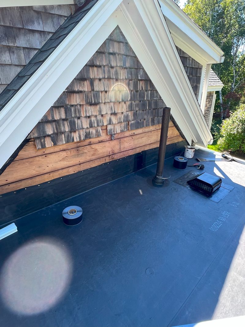 A house with a roof that is being repaired.