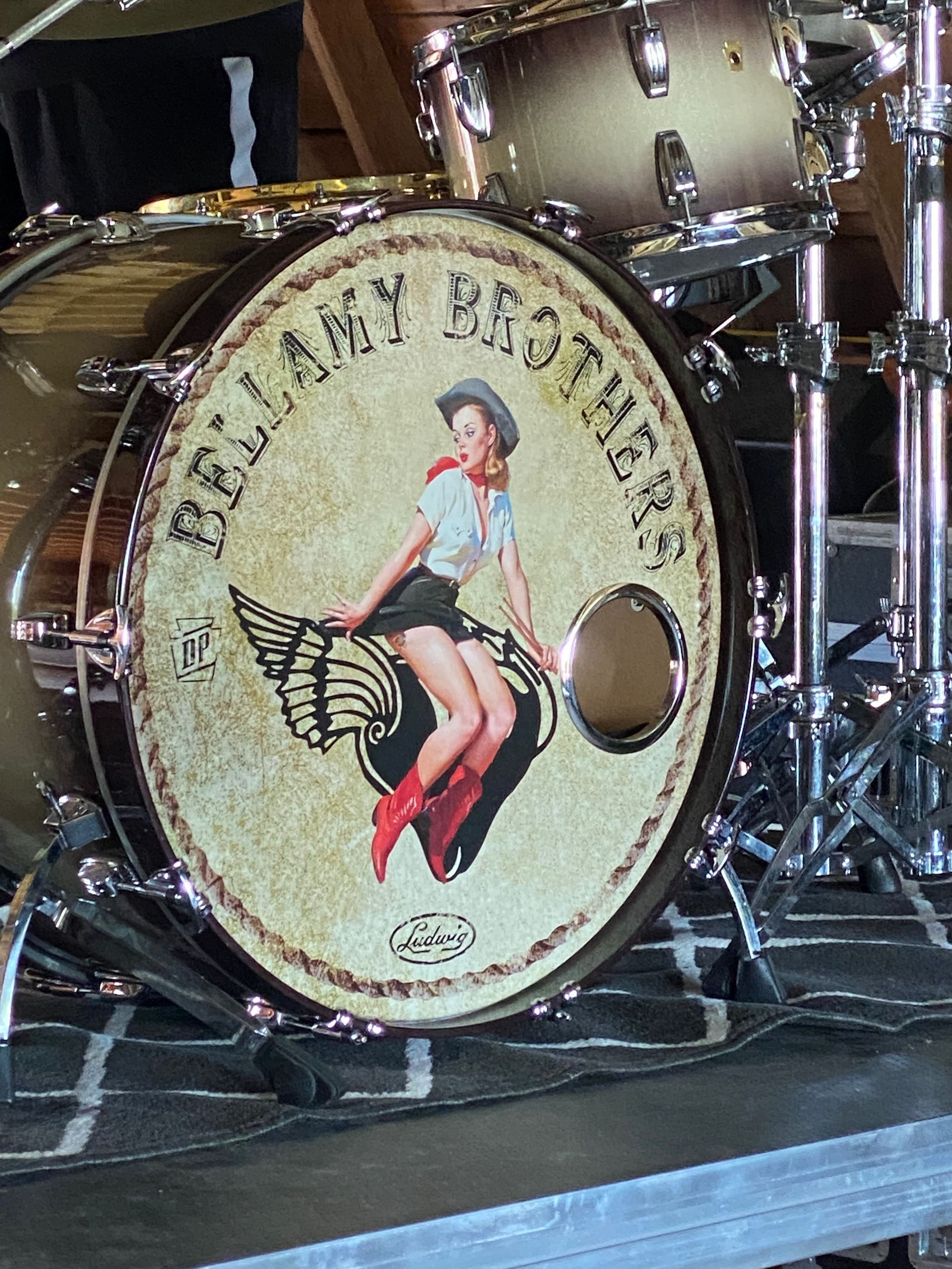 Drum kit bass drum with a vintage pin-up logo and “Beauty Beats” text on the front head