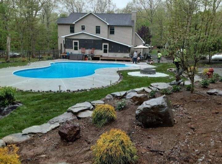 a large house with a swimming pool in the backyard