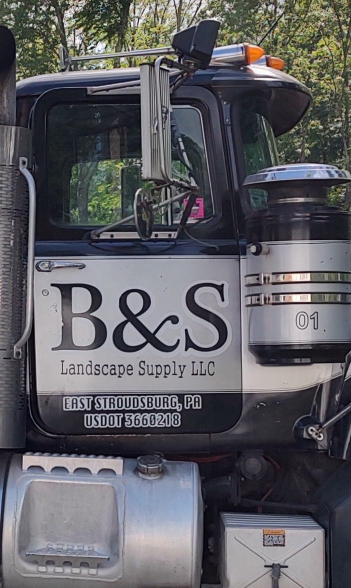 Black and silver B&S Landscape Supply semi-truck.