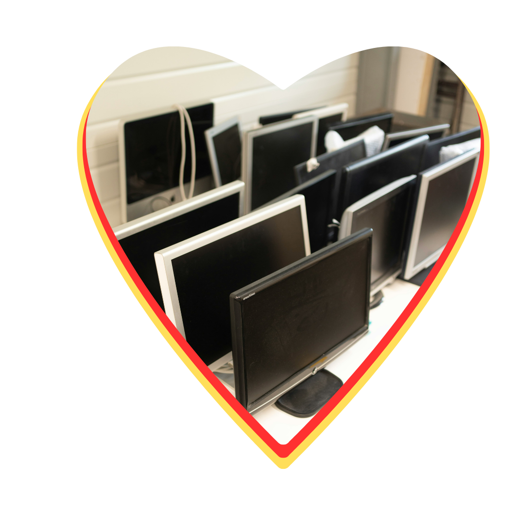 A heart shaped picture of a row of computer monitors