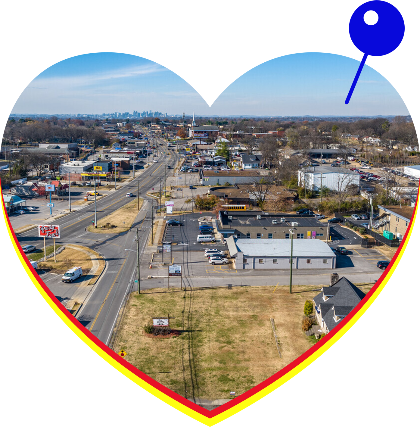 An aerial view of a city in a heart shaped frame