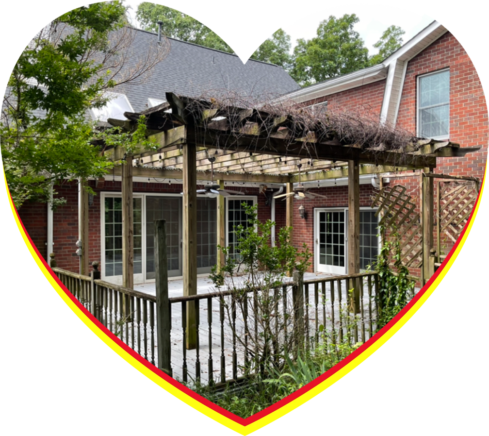 a pergola in front of a house