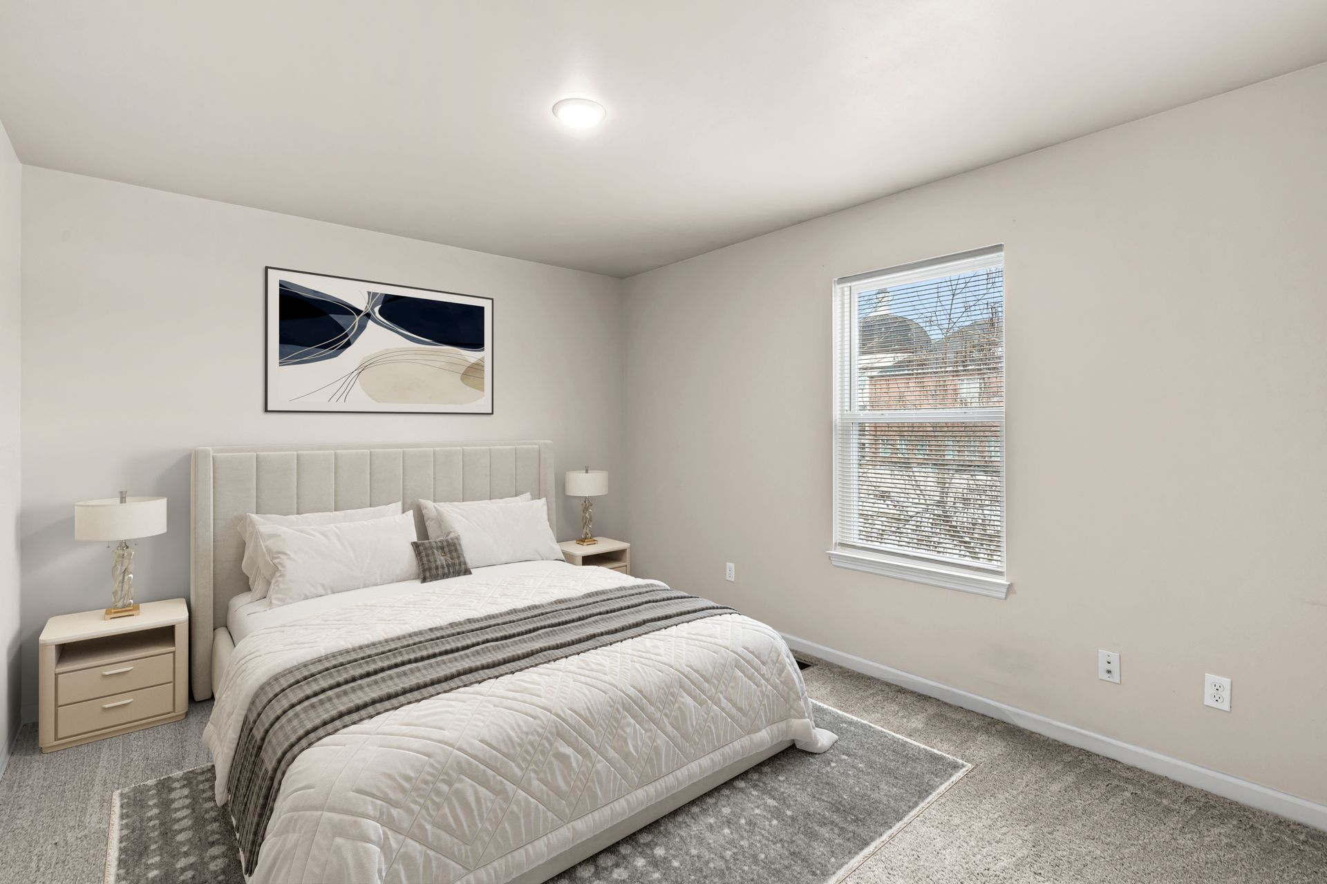 Minimalist bedroom with a white bed, gray rug, and window blinds in a neutral-toned room