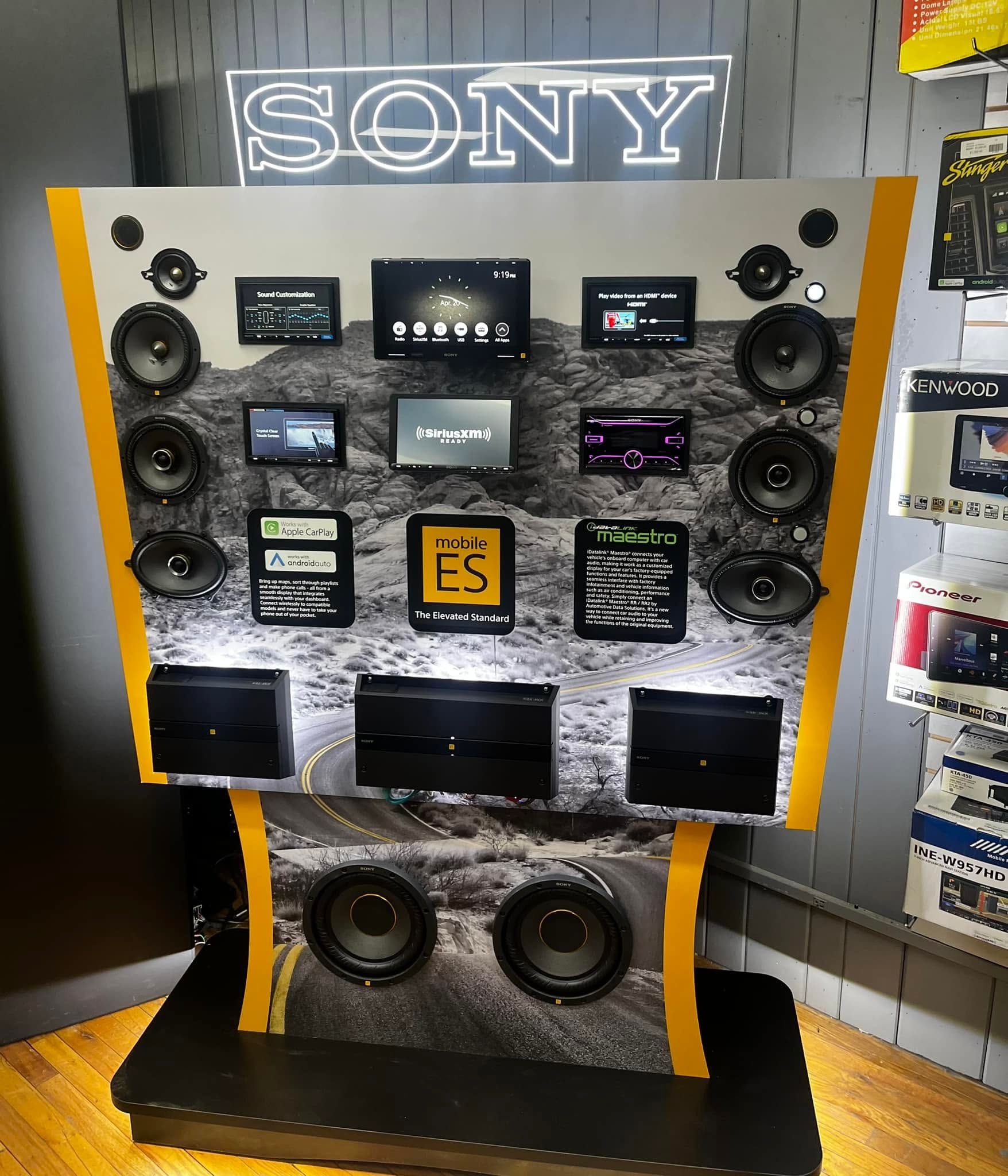 Sony electronics display wall with multiple screens and speakers in a store showroom
