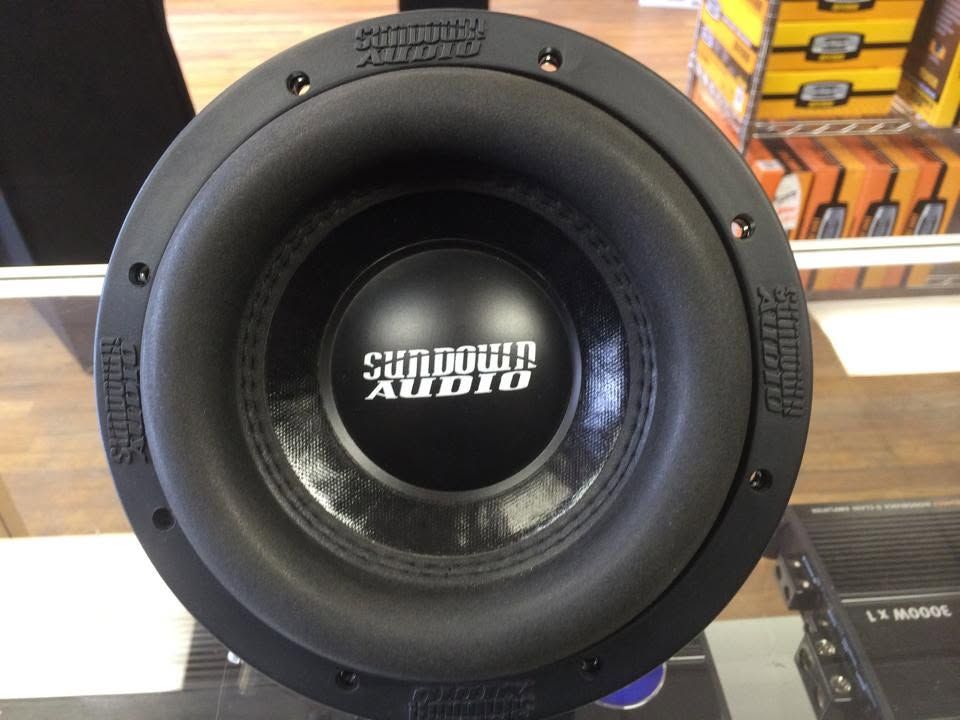 Sundown Audio subwoofer speaker in a display setting, black cone with logo center