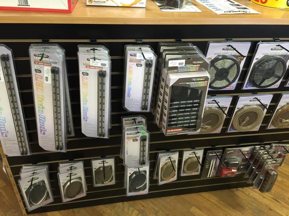 Assorted packaged cables and electronics accessories displayed on store shelves.