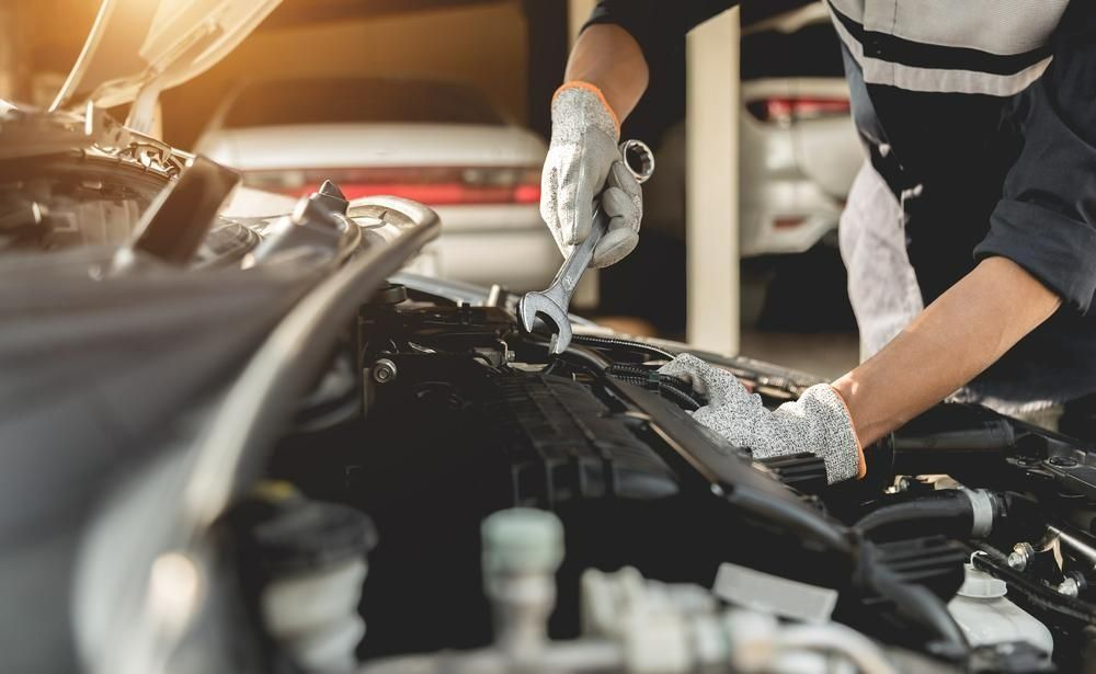 Mechanic Working on a Car Engine With a Wrench — Barnco Automotive Repairs in Gunnedah, NSW