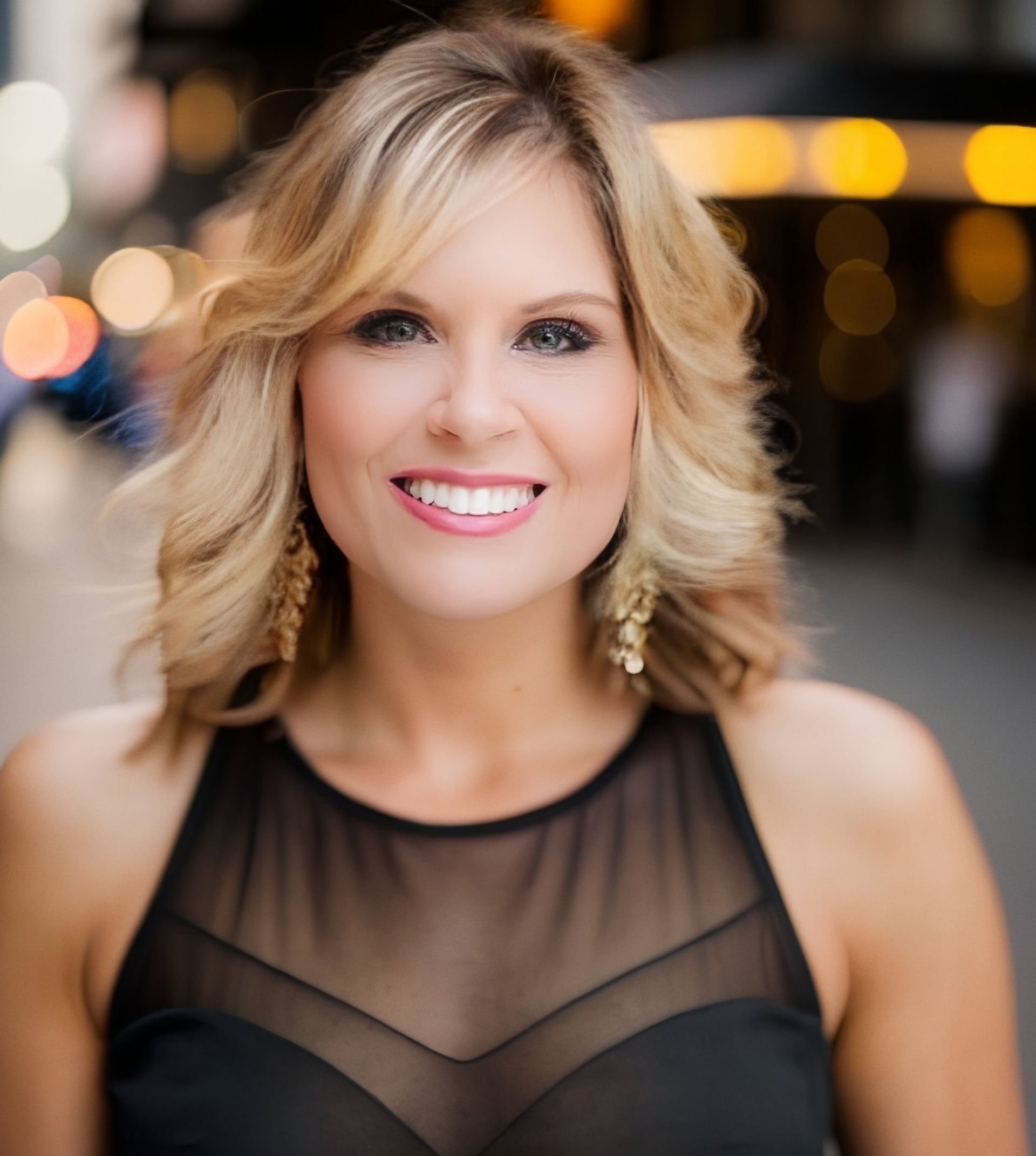 Lady Jen Du Plessis in a black dress is smiling for the camera
