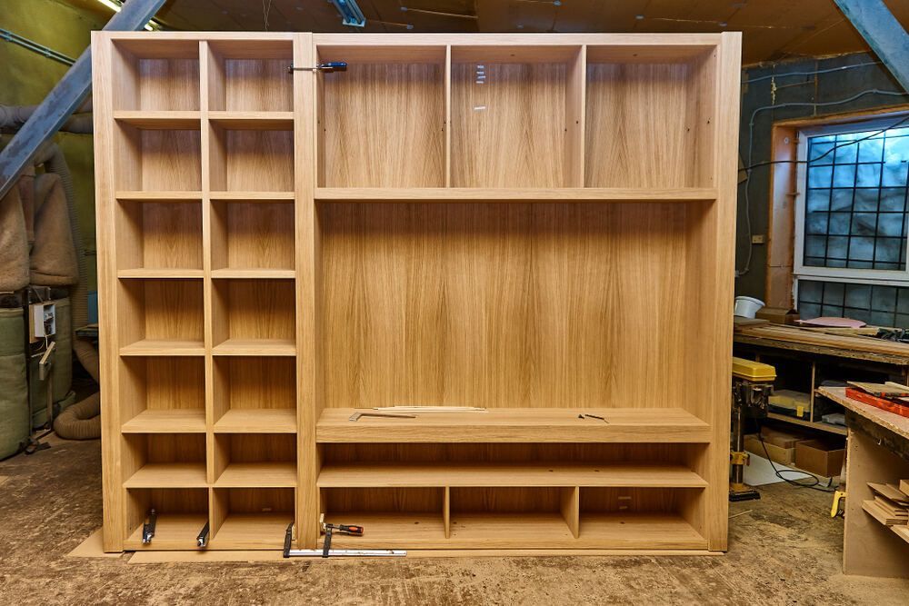 A Large Wooden Shelf is Being Built in a Workshop — Bruce Smith Cabinets in Bray Park, NSW