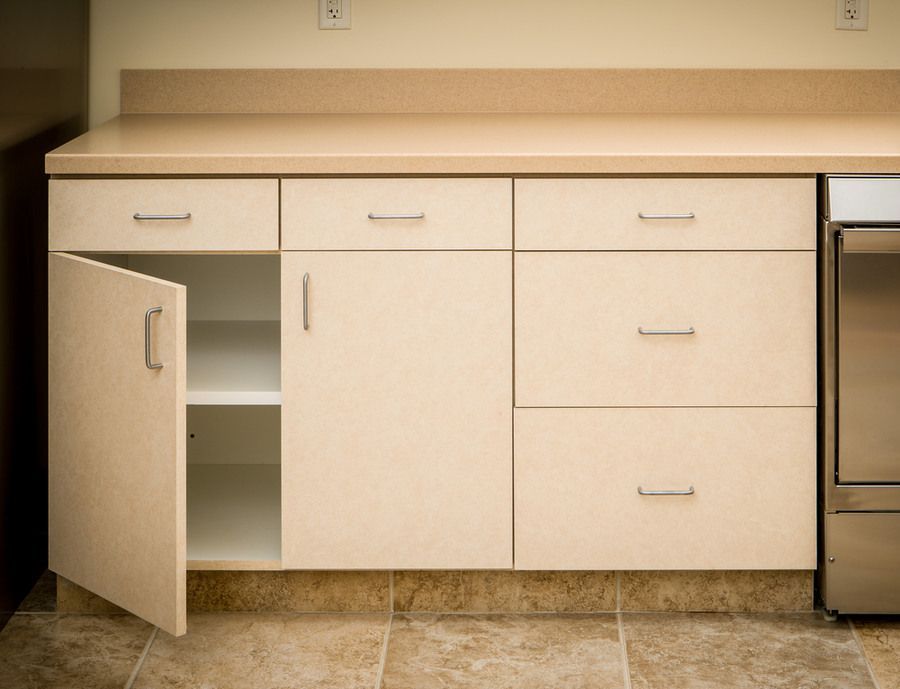 An Empty Kitchen Counter With the Door Open — Bruce Smith Cabinets in Kingscliff, NSW