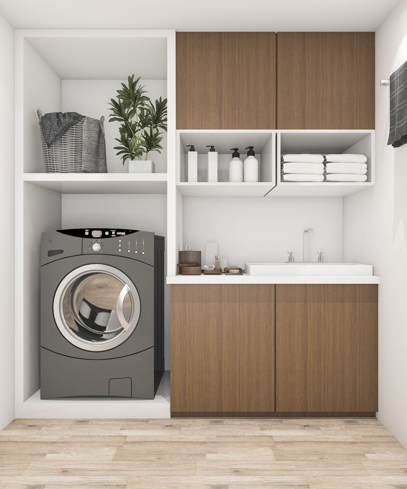 A Laundry Room With a Washer and Dryer and Wooden Cabinets — Bruce Smith Cabinets in Mullumbimby, NSW