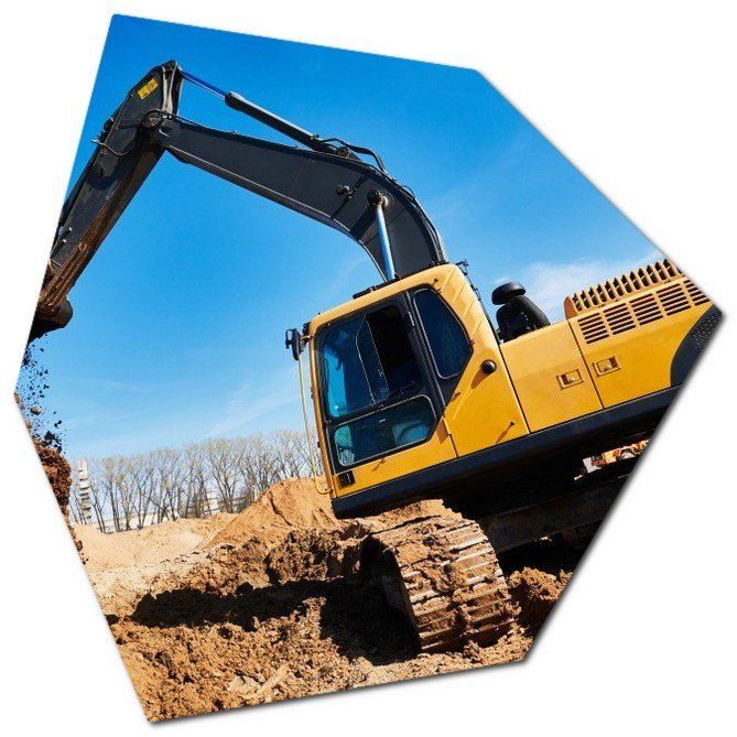 yellow excavator clearing the land