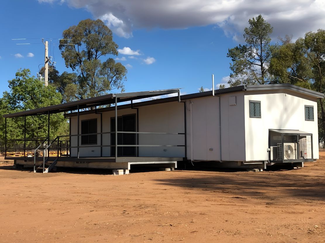 A White House is Sitting in the Middle of a Dirt Field — OSM Transportables In Parkes, NSW