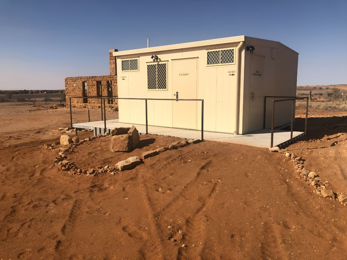 A Small Building in the Middle of a Dirt Field — OSM Transportables In Nyngan, NSW