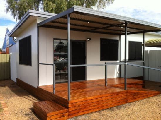 White House With a Wooden Terrace Constructed on a Steel Roof and Fence — OSM Transportables In Dubbo, NSW