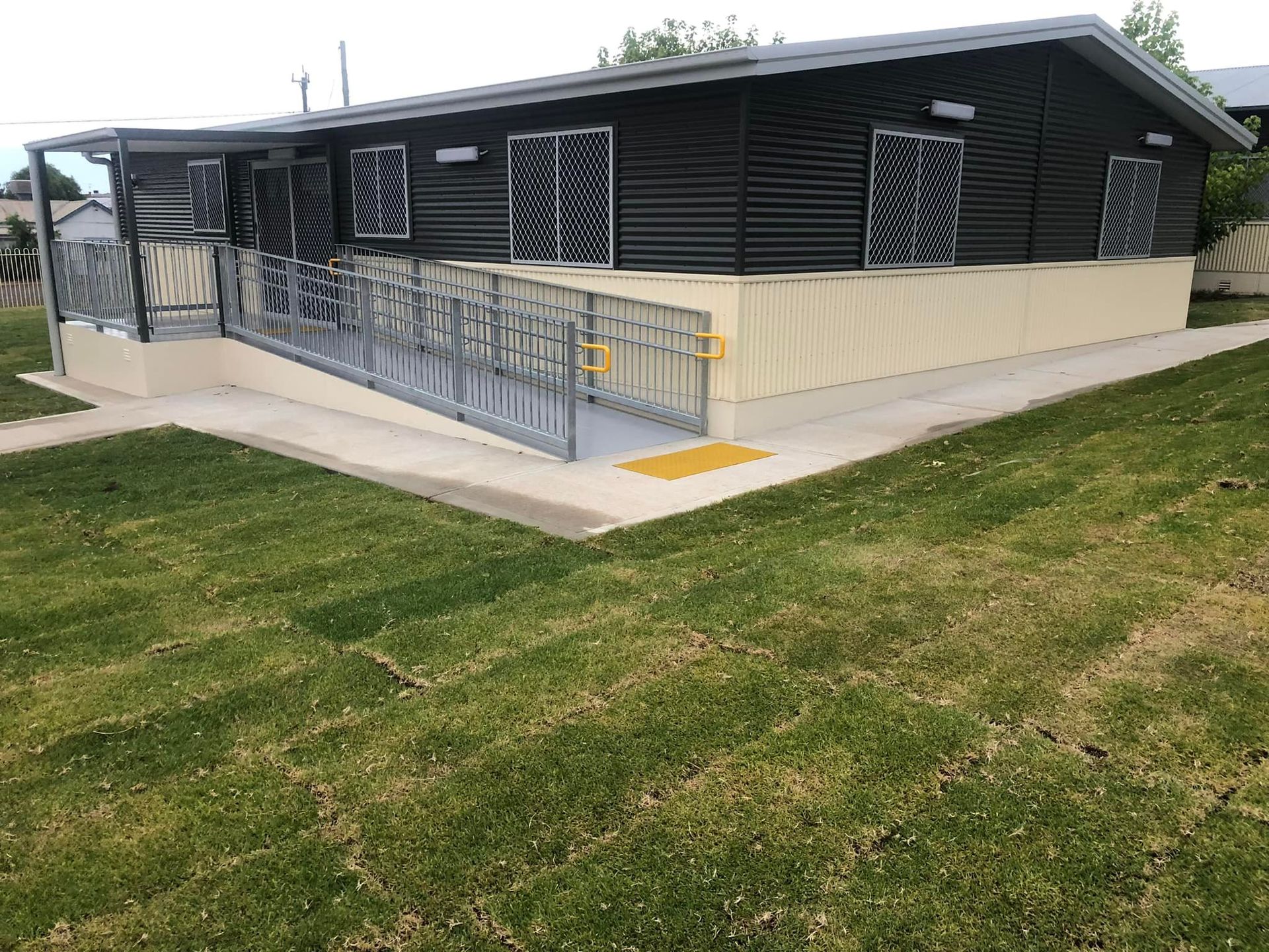 A Portable Building With Dark Corrugated Siding — OSM Transportables In Dubbo, NSW