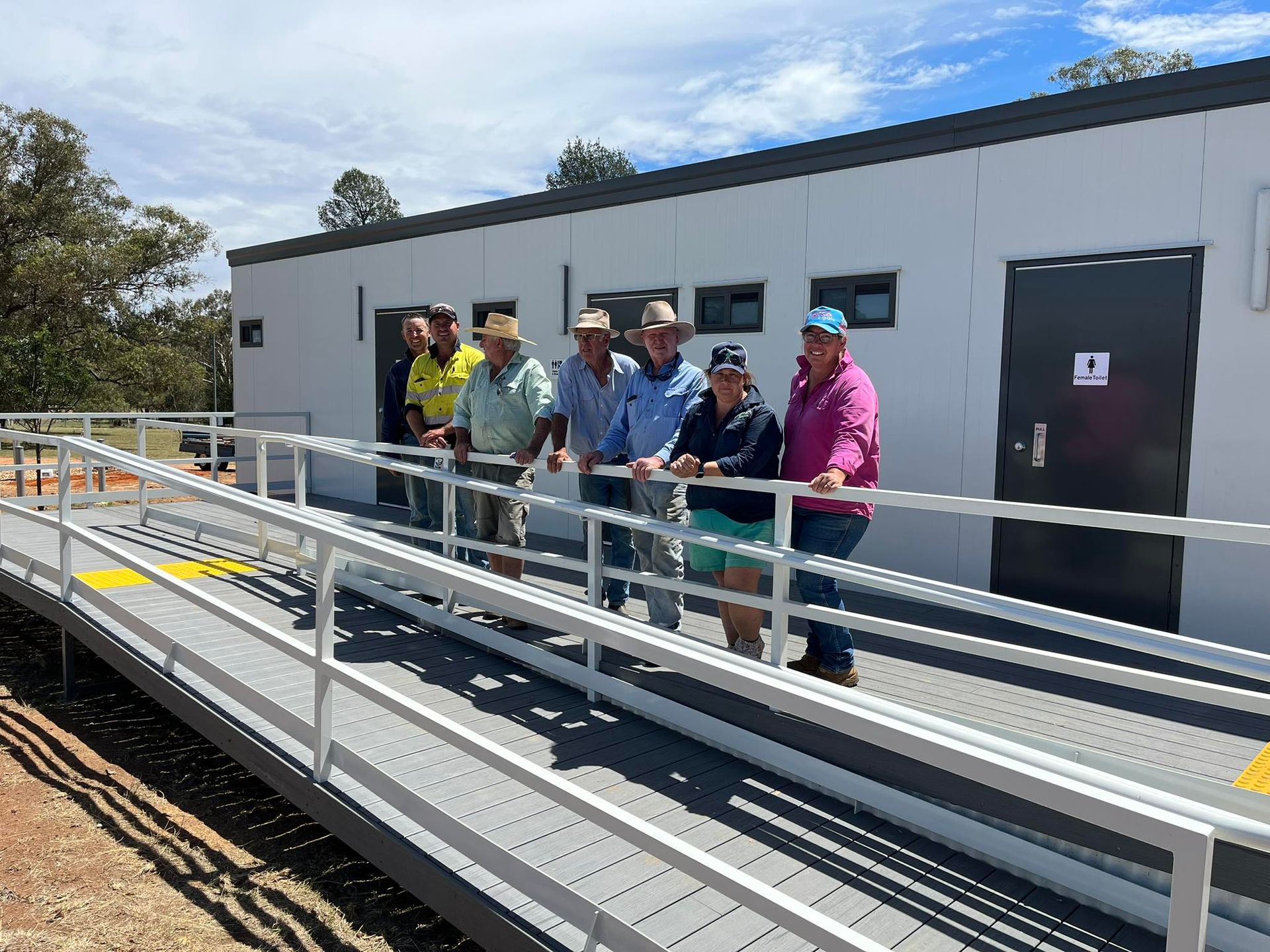 A Group of People Standing on an Accessible Ramp — OSM Transportables In Dubbo, NSW