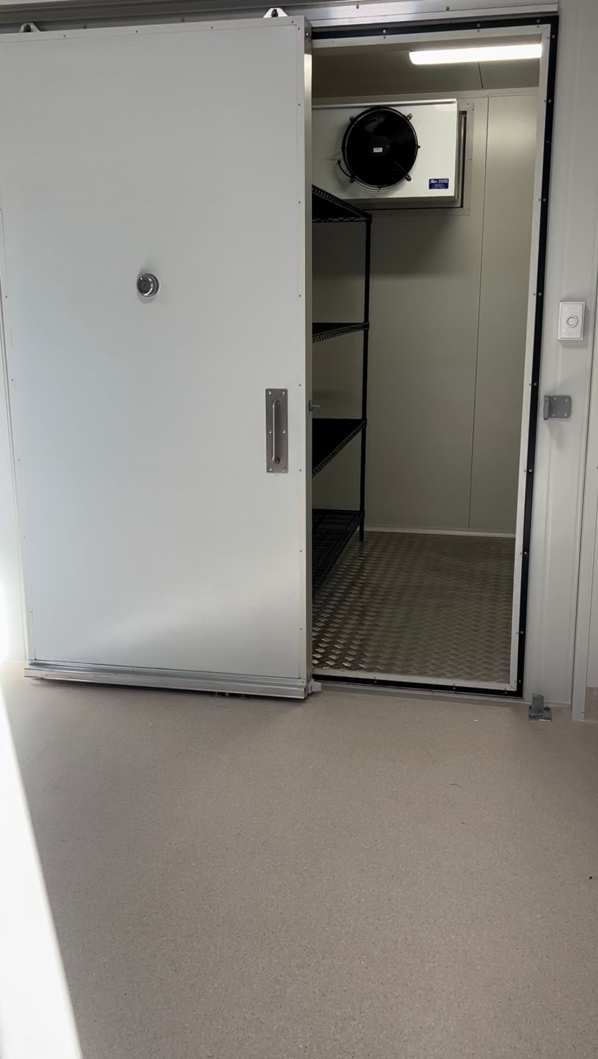 A Room With a Sliding Door and a Fan on the Wall — OSM Transportables In Dubbo, NSW