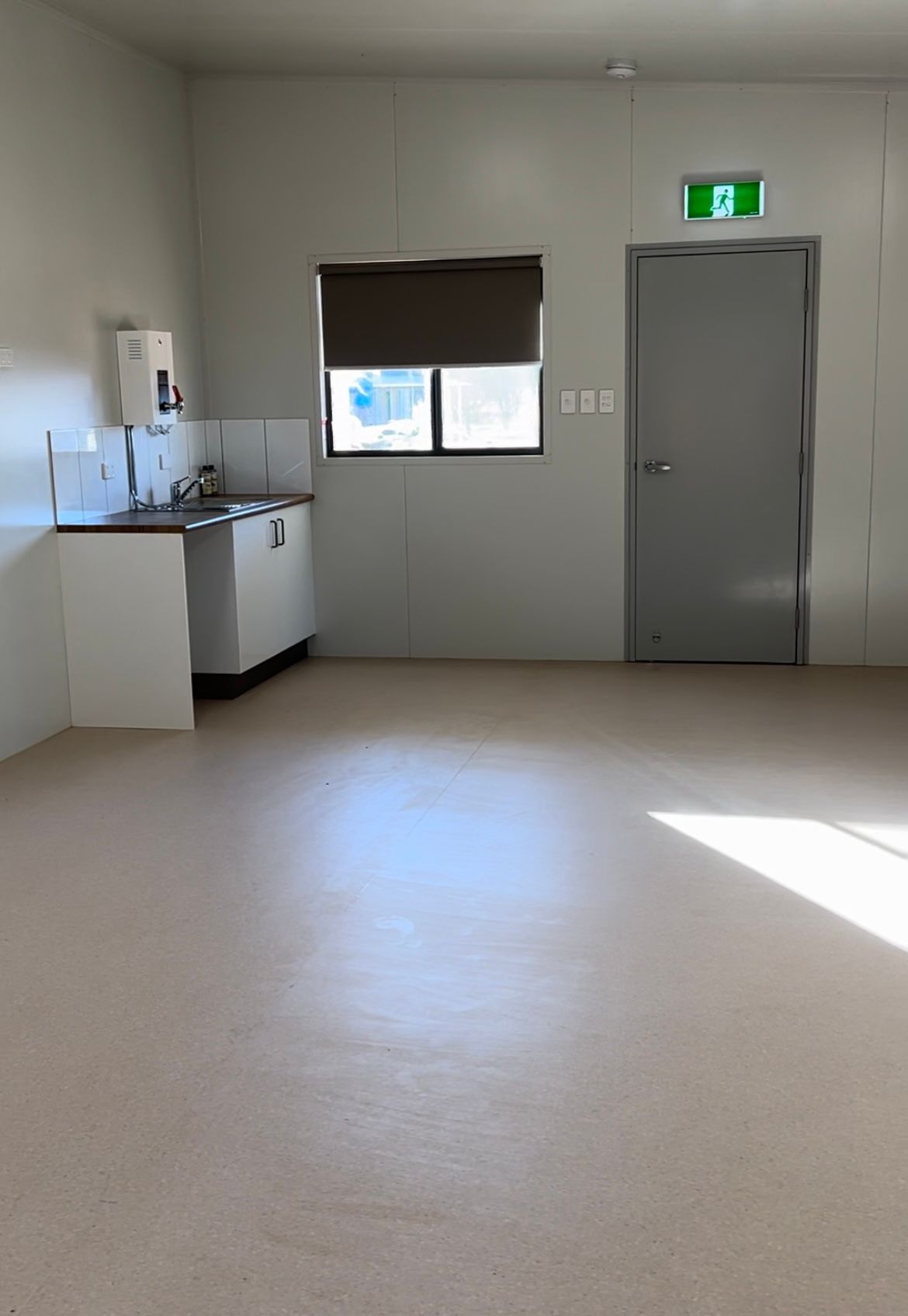 An Empty Room With a Sink and a Window — OSM Transportables In Dubbo, NSW