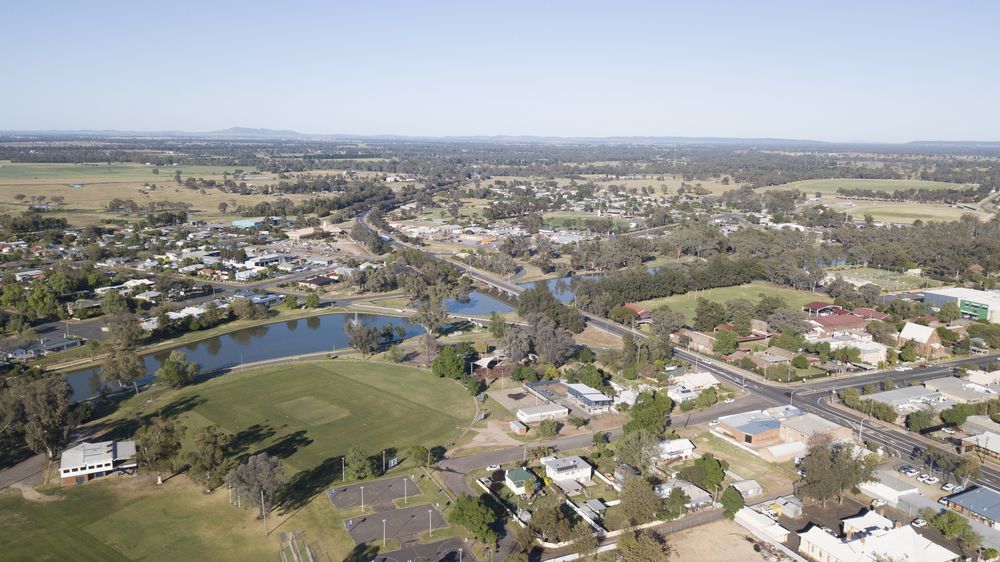 An Aerial View of a Small Town With a Lake in the Middle of It — OSM Transportables In Forbes, NSW