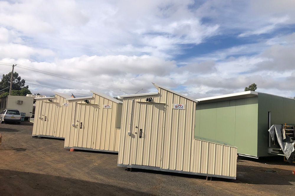 3 Identical Portable Houses With Osm Sign on Its Top — OSM Transportables In Dubbo, NSW
