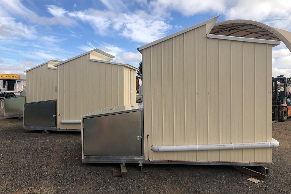 3 Identical Portable Houses With Trash Bin Installed on Its Back — OSM Transportables In Dubbo, NSW