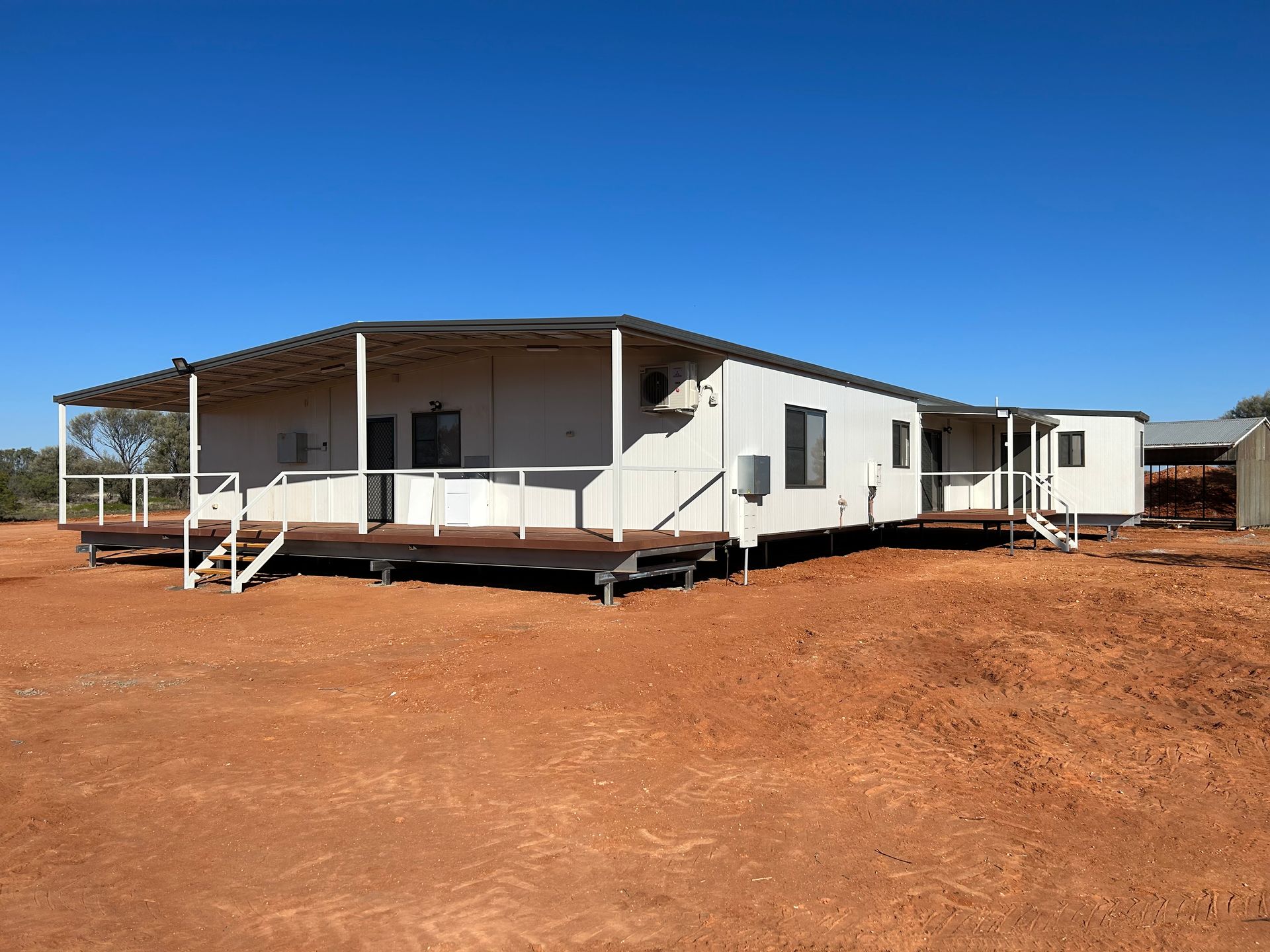 Side View of the Dark Portable House With Window Glass — OSM Transportables In Dubbo, NSW