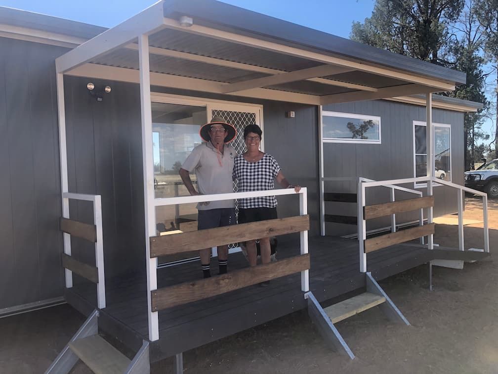 Man and Woman Standing Together on the Porch of a Transportable House — OSM Transportables In Dubbo, NSW