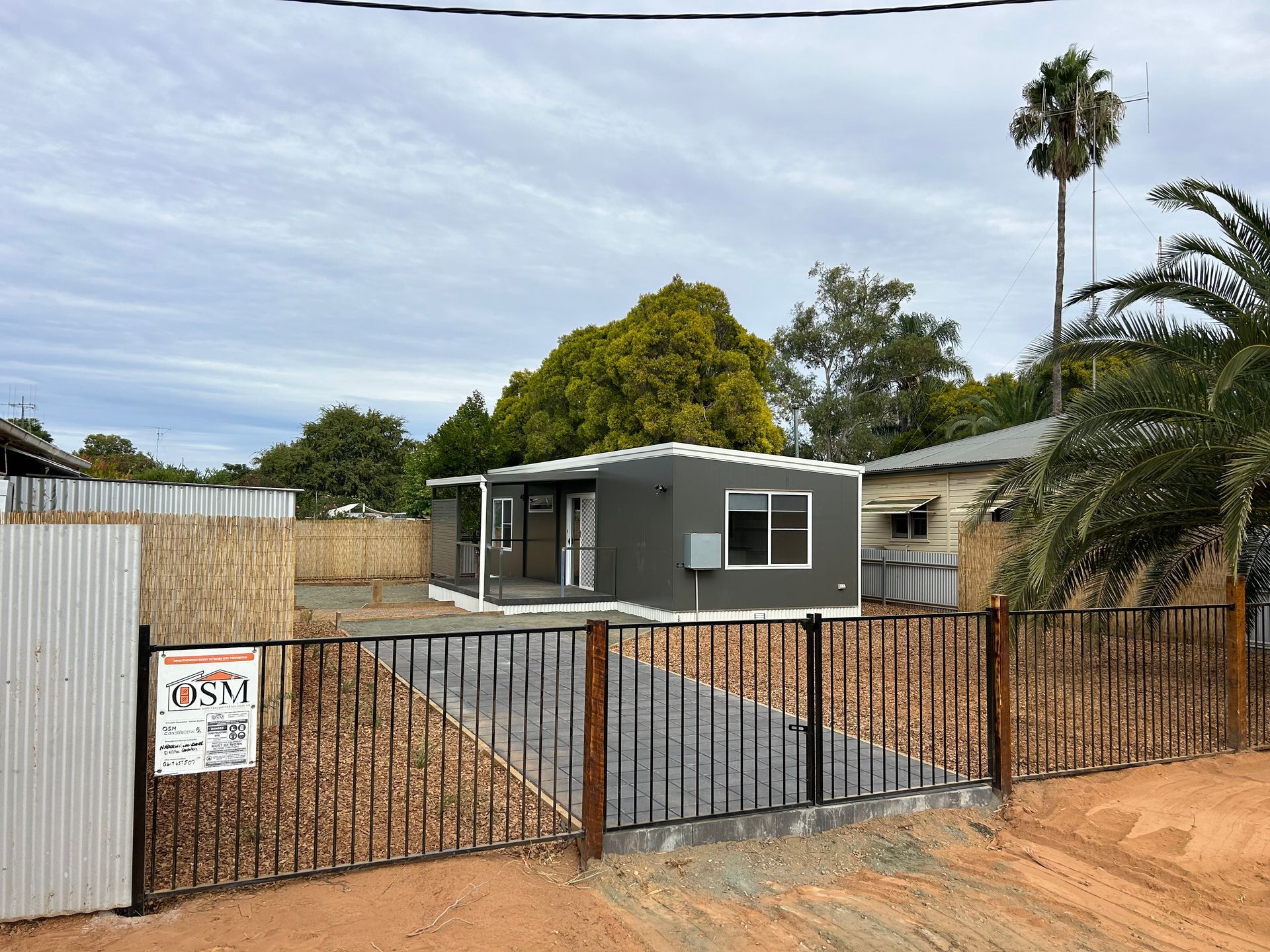 Portable White Container Houses Featuring a Steel Staircase for Convenient Access — OSM Transportables In Dubbo, NSW