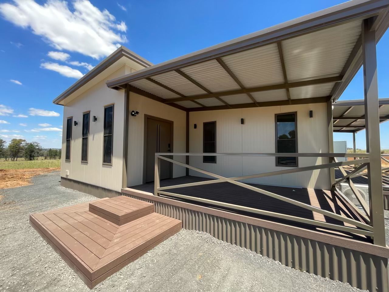 A Small, Modern, Light-colored Cabin With a Covered Deck — OSM Transportables In Dubbo, NSW
