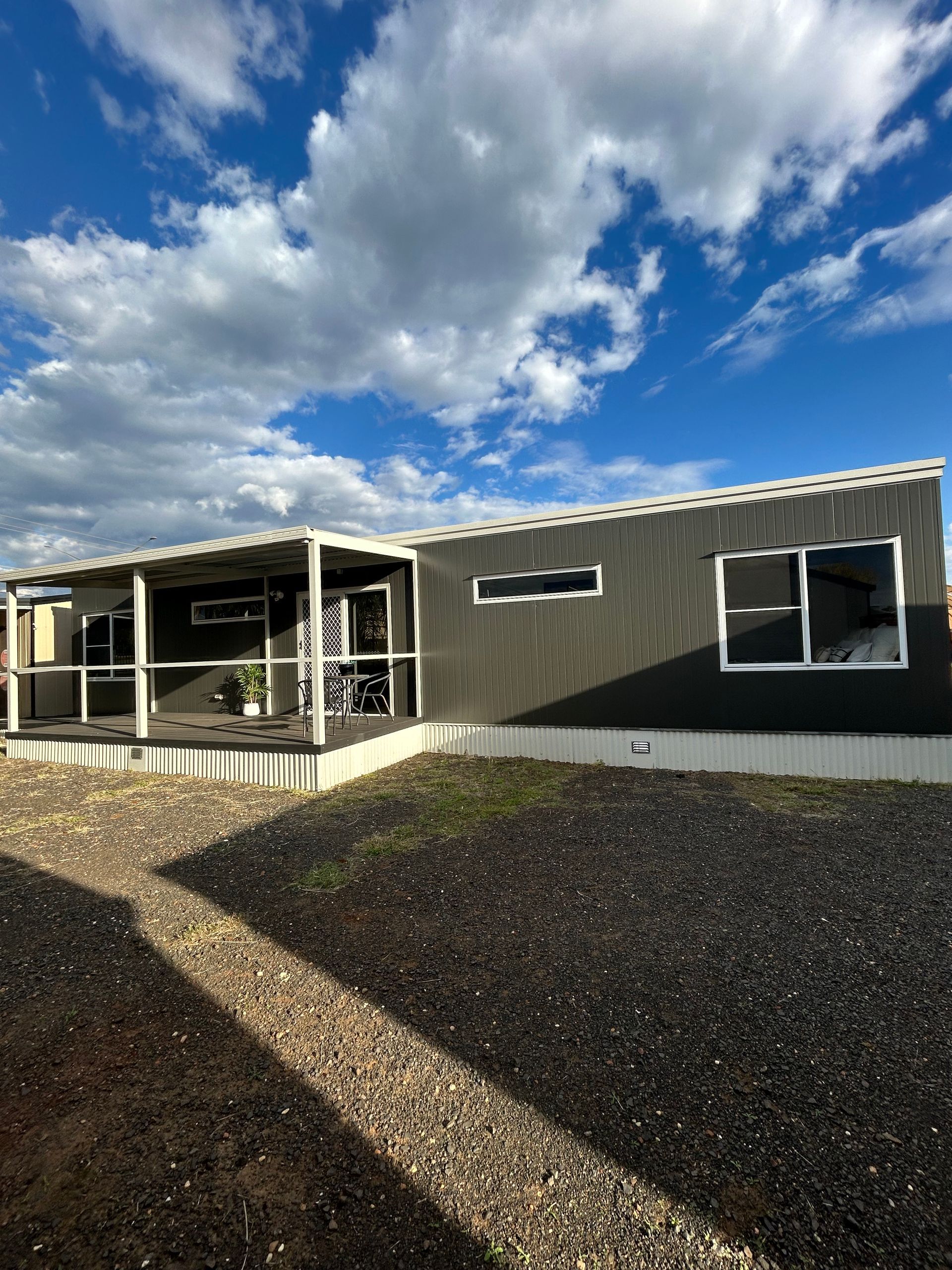 A Modern, Dark-gray Modular Home With a Covered Front Porch — OSM Transportables In Dubbo, NSW